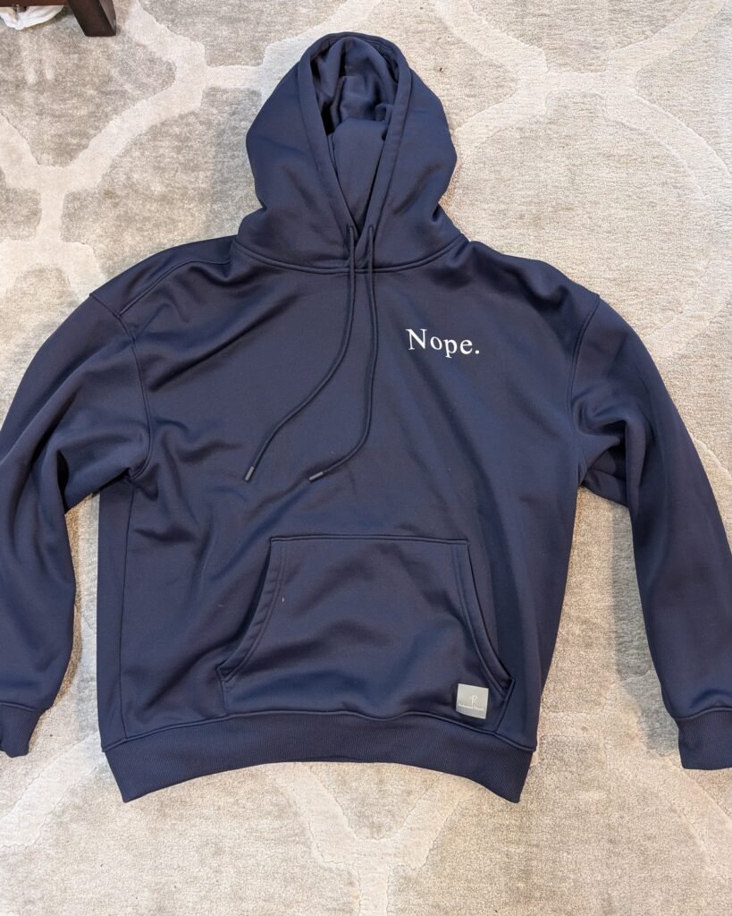 "Nope." hoodie in navy, front